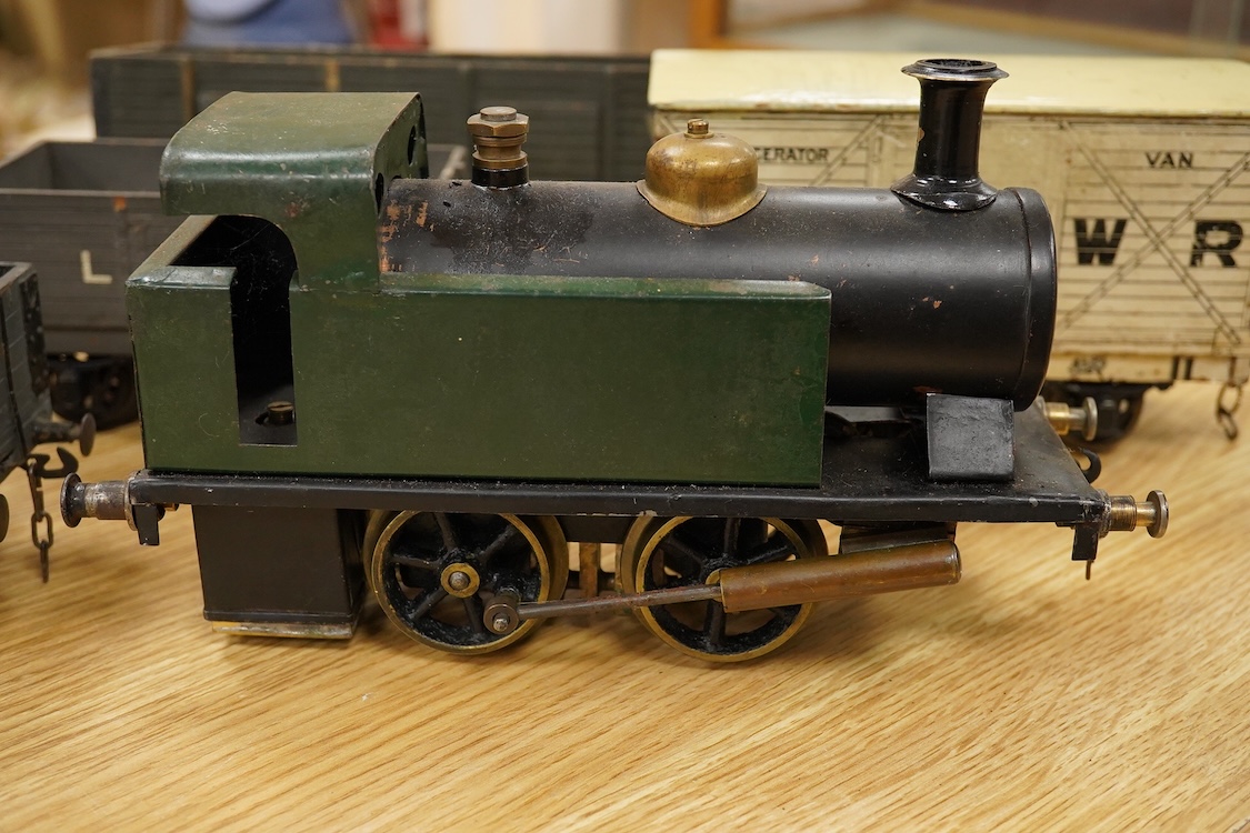 A Gauge One live steam 0-4-0T locomotive in the style of a Bowman model locomotive, with spirit fired with two simple outside oscillating cylinders, together with five LNWR and Midland Railway freight wagons, including a